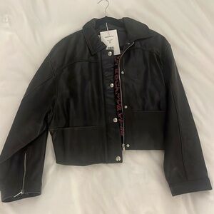 One of a kind! Beautiful brand new leather coat by Saks Potts. Very stylish.